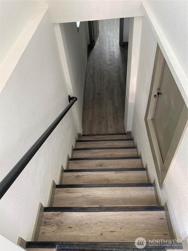 604 SW 4th St, College Place, WA 99324 - staircase with wood finished floors and a textured wall