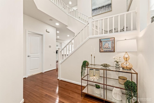 17710 39th Ave SE, Bothell, WA 98012 - staircase featuring hardwood / wood-style flooring, recessed lighting, and a towering ceiling