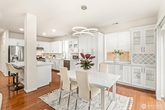 17710 39th Ave SE, Bothell, WA 98012 - dining area featuring light wood-style floors, recessed lighting, and a chandelier