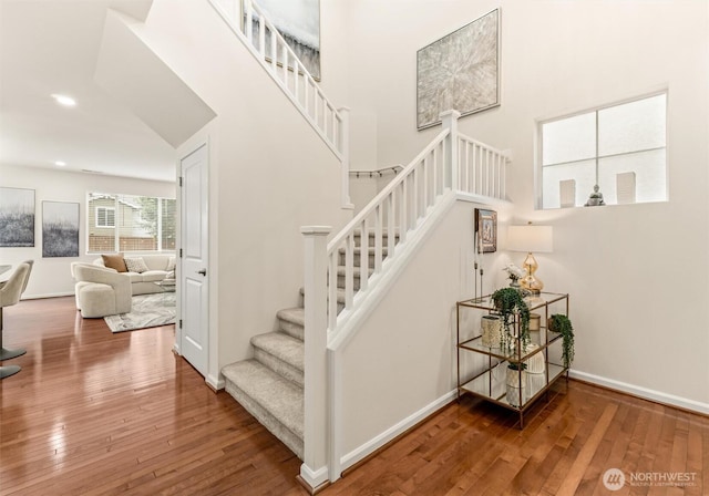 17710 39th Ave SE, Bothell, WA 98012 - stairway featuring hardwood / wood-style flooring, a high ceiling, and recessed lighting