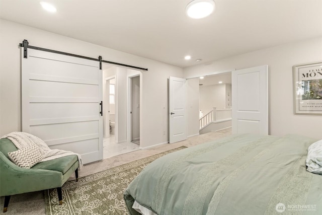 17710 39th Ave SE, Bothell, WA 98012 - carpeted bedroom with a barn door, ensuite bath, and recessed lighting