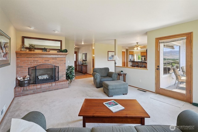 622 Vista View Pl, East Wenatchee, WA 98802 - living area featuring carpet flooring, a brick fireplace, and ceiling fan