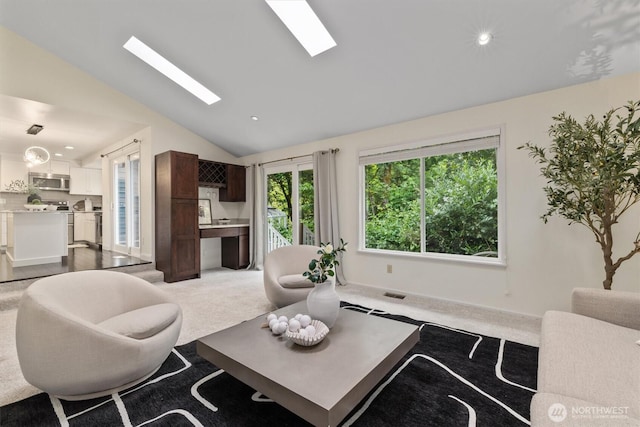 9132 NE 143rd Pl, Kirkland, WA 98034 - living room featuring lofted ceiling, a skylight, carpet, and recessed lighting