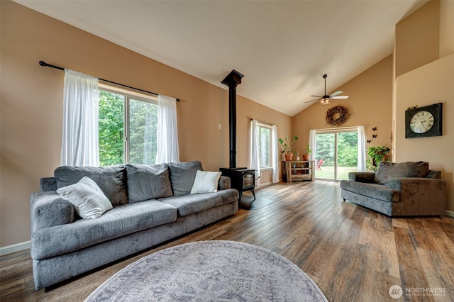 118 Bald Eagle Rd, Ariel, WA 98603 - living area with a wood stove, ceiling fan, wood finished floors, and high vaulted ceiling