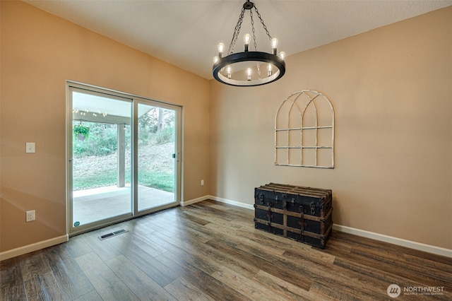 118 Bald Eagle Rd, Ariel, WA 98603 - spare room featuring a chandelier and wood finished floors
