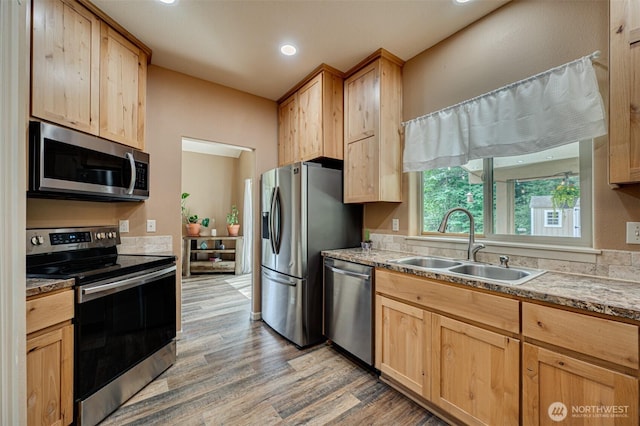 118 Bald Eagle Rd, Ariel, WA 98603 - kitchen featuring stainless steel appliances, light brown cabinets, light wood-style flooring, recessed lighting, and light stone counters
