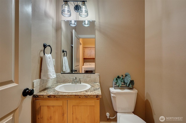 118 Bald Eagle Rd, Ariel, WA 98603 - half bathroom with washer / clothes dryer and vanity