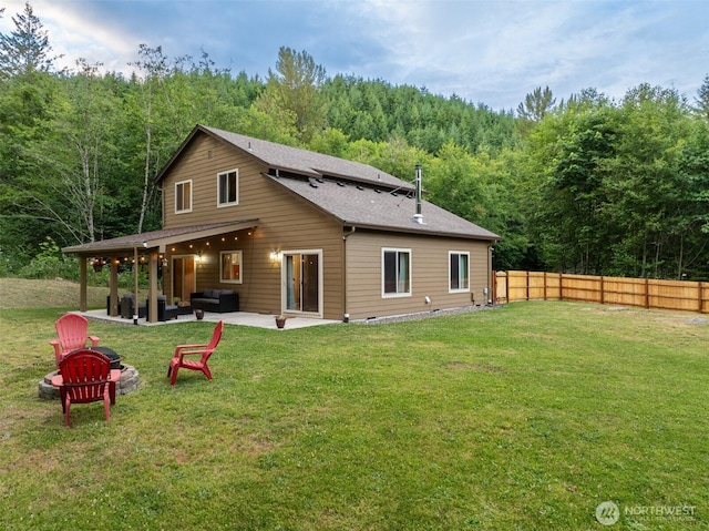 118 Bald Eagle Rd, Ariel, WA 98603 - rear view of property featuring an outdoor fire pit, a view of trees, and a patio area