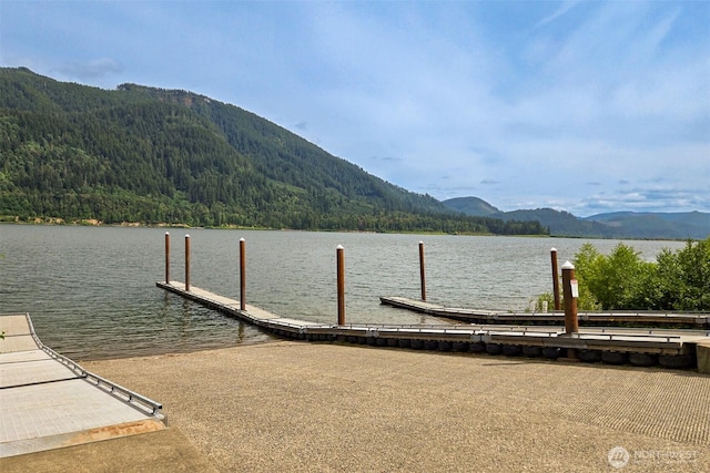 118 Bald Eagle Rd, Ariel, WA 98603 - dock featuring a boat ramp, a view of trees, and a water and mountain view