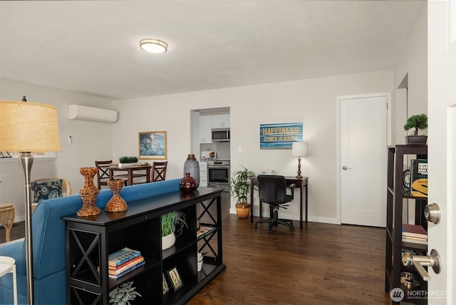 7337 19th Ave SW, Seattle, WA 98106 - living area with a wall unit AC, dark wood finished floors, and a desk