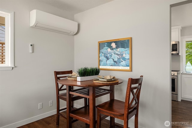 7337 19th Ave SW, Seattle, WA 98106 - dining area with a wall unit AC and wood finished floors