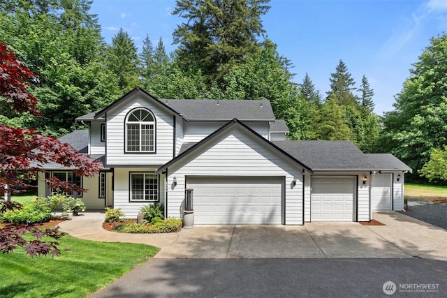 6211 18th Ave SW, Olympia, WA 98512 - traditional-style home featuring an attached garage, driveway, and a shingled roof