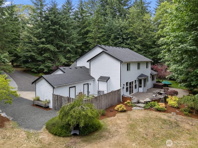 6211 18th Ave SW, Olympia, WA 98512 - back of property with a patio and a shingled roof