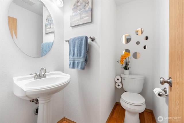 6211 18th Ave SW, Olympia, WA 98512 - bathroom featuring wood finished floors and toilet