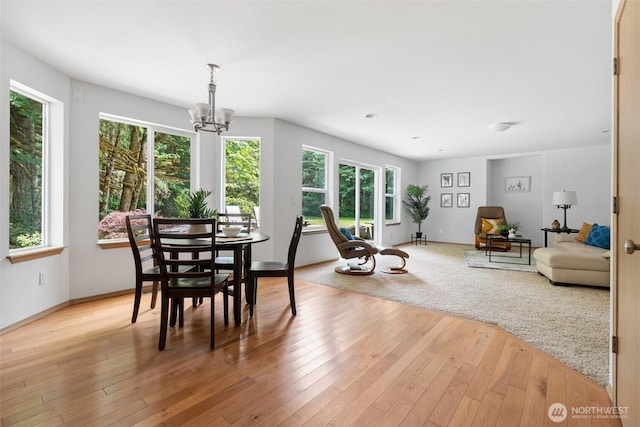 6211 18th Ave SW, Olympia, WA 98512 - dining area featuring healthy amount of natural light, a chandelier, and light wood finished floors