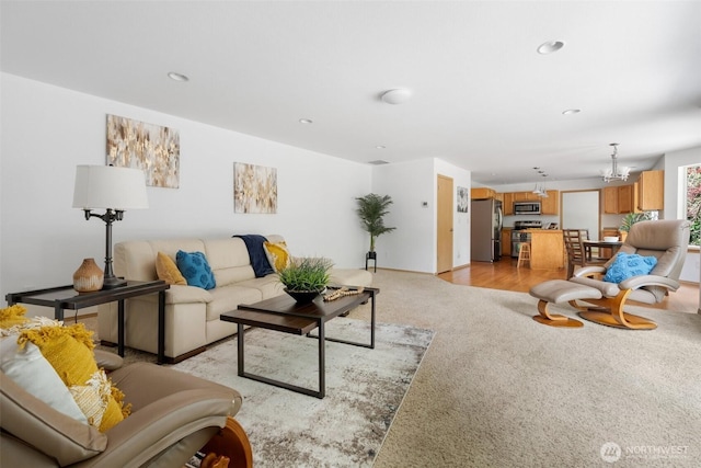 6211 18th Ave SW, Olympia, WA 98512 - living room with light colored carpet, recessed lighting, and a chandelier