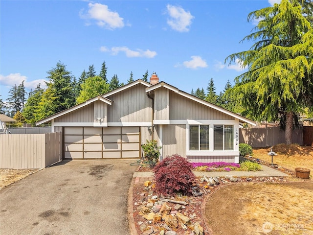 16002 5th Ave E, Tacoma, WA 98445 - mid-century inspired home with an attached garage, driveway, and a chimney