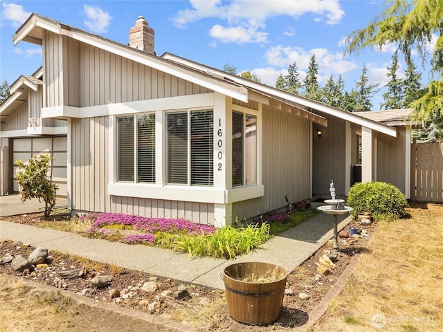 16002 5th Ave E, Tacoma, WA 98445 - view of front of property with a chimney and an attached garage