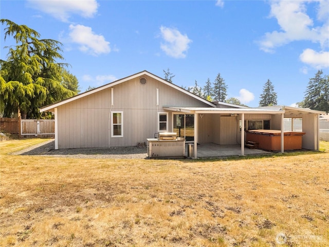 16002 5th Ave E, Tacoma, WA 98445 - back of house featuring a hot tub, a patio, and area for grilling