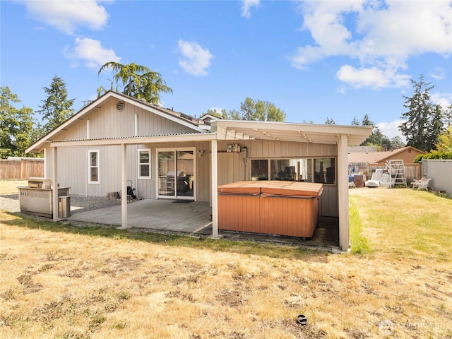 16002 5th Ave E, Tacoma, WA 98445 - rear view of property with a hot tub and a patio area