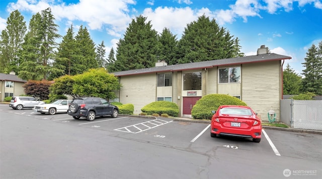 17529 151st Ave SE Unit 7-8, Renton, WA 98058 - view of front facade with a chimney and uncovered parking