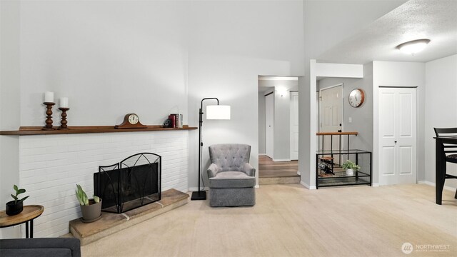 17529 151st Ave SE Unit 7-8, Renton, WA 98058 - living area featuring carpet and a brick fireplace