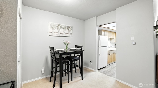 17529 151st Ave SE Unit 7-8, Renton, WA 98058 - dining room with light colored carpet and baseboards