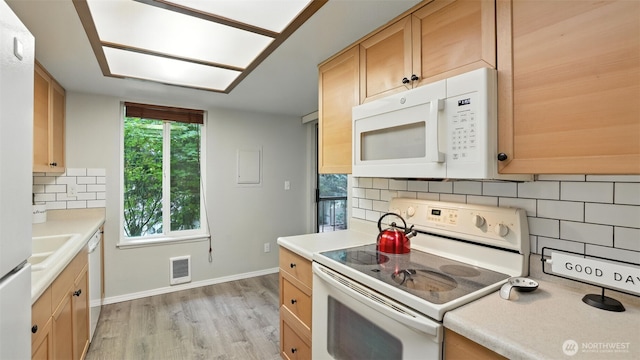 17529 151st Ave SE Unit 7-8, Renton, WA 98058 - kitchen with white appliances, decorative backsplash, light countertops, light wood-style flooring, and light brown cabinets