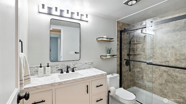 17529 151st Ave SE Unit 7-8, Renton, WA 98058 - bathroom with tasteful backsplash, vanity, an enclosed shower, and a textured ceiling