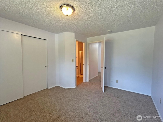 5519 65th Ave SE, Olympia, WA 98513 - unfurnished bedroom with carpet, a closet, and a textured ceiling