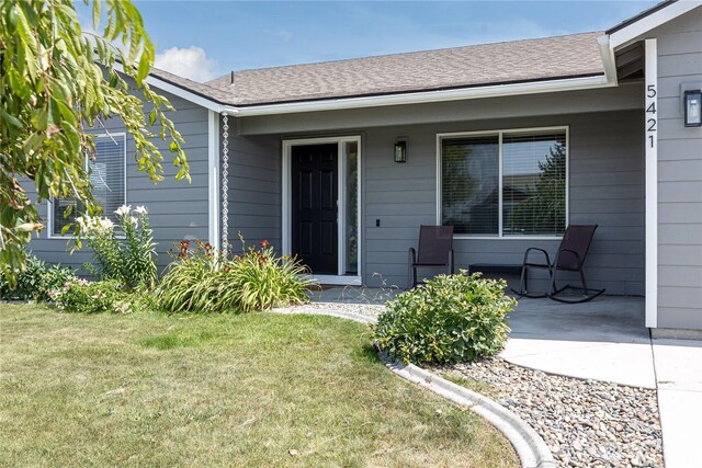 5421 Jackson Ln, Pasco, WA 99301 - doorway to property featuring a lawn and a porch