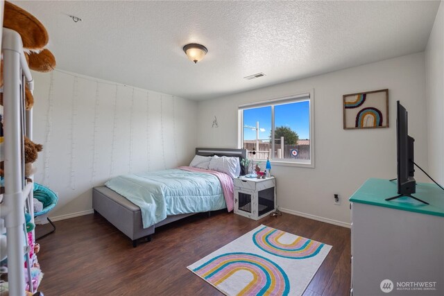 5421 Jackson Ln, Pasco, WA 99301 - bedroom featuring wood finished floors and a textured ceiling