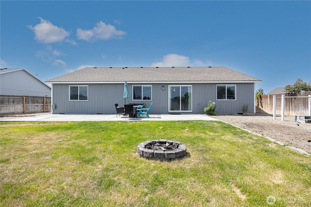 5421 Jackson Ln, Pasco, WA 99301 - back of property featuring a patio, a fire pit, and a fenced backyard