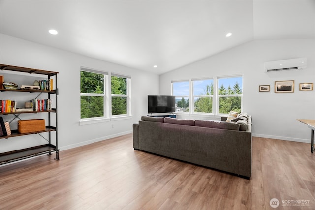 1172 Thorndyke Rd, Port Ludlow, WA 98365 - living area with an AC wall unit, vaulted ceiling, light wood-type flooring, and recessed lighting