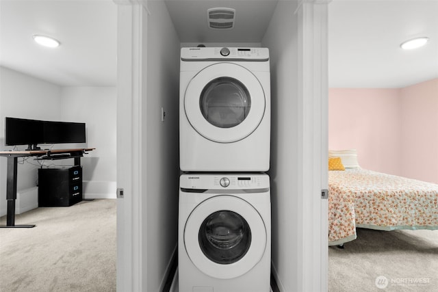 1172 Thorndyke Rd, Port Ludlow, WA 98365 - laundry room featuring estacked washer and dryer, carpet, and recessed lighting