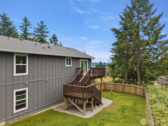 1172 Thorndyke Rd, Port Ludlow, WA 98365 - back of property with stairway, a deck, a shingled roof, and board and batten siding