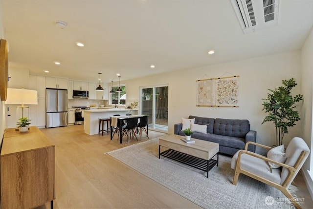 10342 39th Ave NE, Seattle, WA 98125 - living area featuring light wood finished floors and recessed lighting