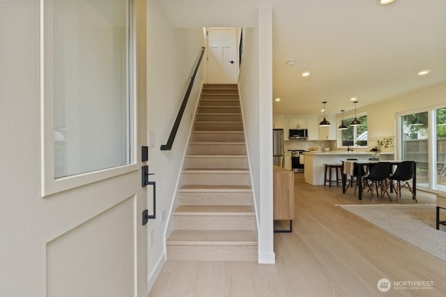 10342 39th Ave NE, Seattle, WA 98125 - stairway featuring wood finished floors and recessed lighting