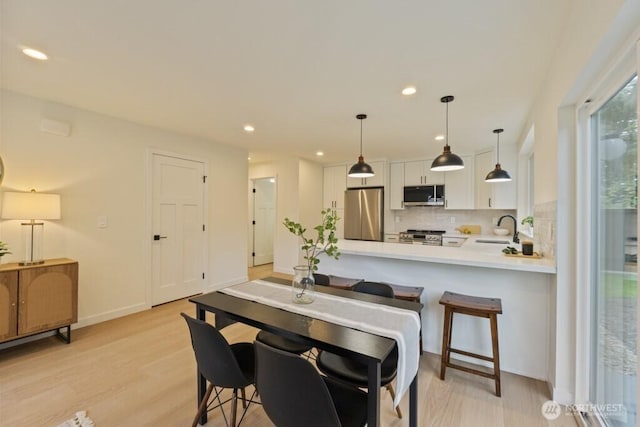 10342 39th Ave NE, Seattle, WA 98125 - dining area featuring recessed lighting and light wood finished floors