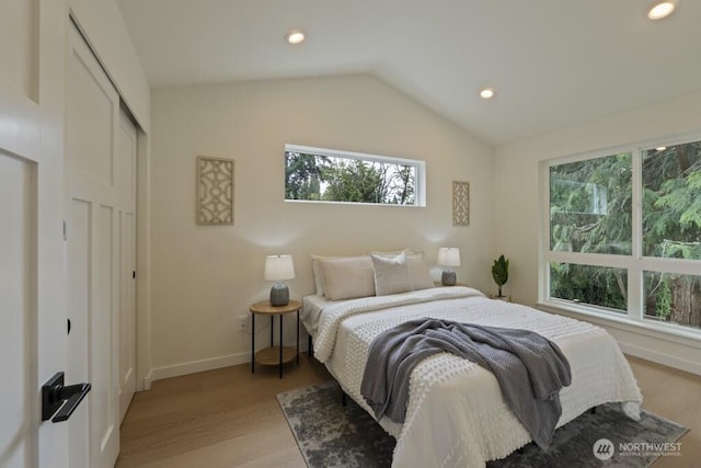 10342 39th Ave NE, Seattle, WA 98125 - bedroom featuring light wood-style flooring, lofted ceiling, recessed lighting, and a closet