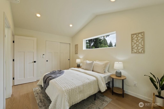 10342 39th Ave NE, Seattle, WA 98125 - bedroom featuring vaulted ceiling, wood finished floors, a closet, and recessed lighting