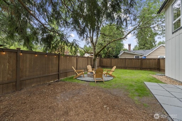 10342 39th Ave NE, Seattle, WA 98125 - fenced backyard with a fire pit