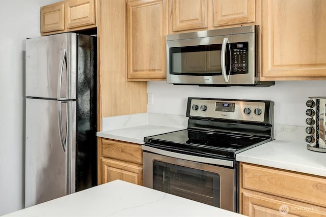 921 Pershing Ave Unit 101, Bremerton, WA 98312 - kitchen with appliances with stainless steel finishes, light brown cabinets, and light countertops