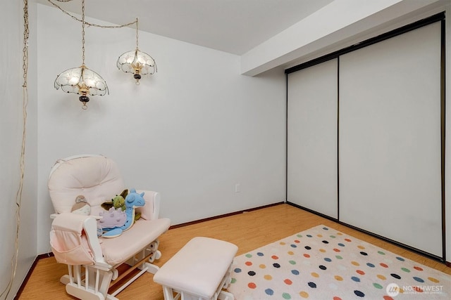 921 Pershing Ave Unit 101, Bremerton, WA 98312 - sitting room featuring light wood-style floors and a chandelier