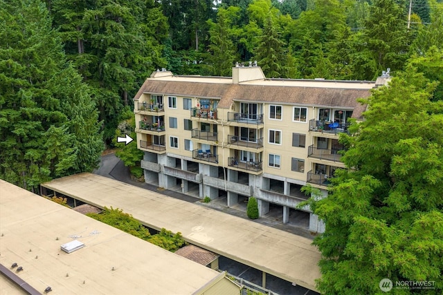 921 Pershing Ave Unit 101, Bremerton, WA 98312 - view of apartment building / complex featuring a view of trees