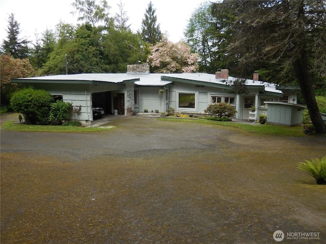 3649 Long Lake Rd SE, Port Orchard, WA 98366 - mid-century inspired home featuring driveway, a carport, and a chimney