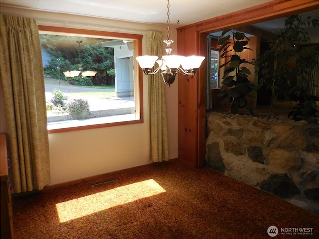 3649 Long Lake Rd SE, Port Orchard, WA 98366 - unfurnished dining area featuring a chandelier and carpet floors