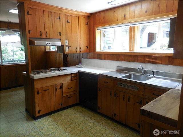 3649 Long Lake Rd SE, Port Orchard, WA 98366 - kitchen featuring under cabinet range hood, cooktop, healthy amount of natural light, light flooring, and wooden walls