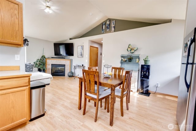 858 Willow Ct SW, Ocean Shores, WA 98569 - dining room with light wood-style floors, lofted ceiling, and a high end fireplace