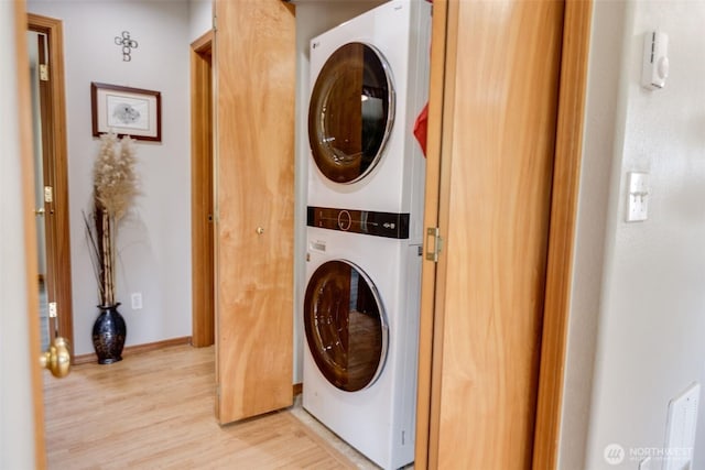 858 Willow Ct SW, Ocean Shores, WA 98569 - washroom featuring stacked washer / dryer and light wood-style flooring